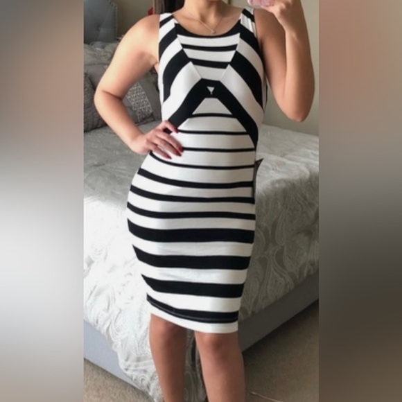 bebe Dresses & Skirts - Bebe black and white striped dress size Large